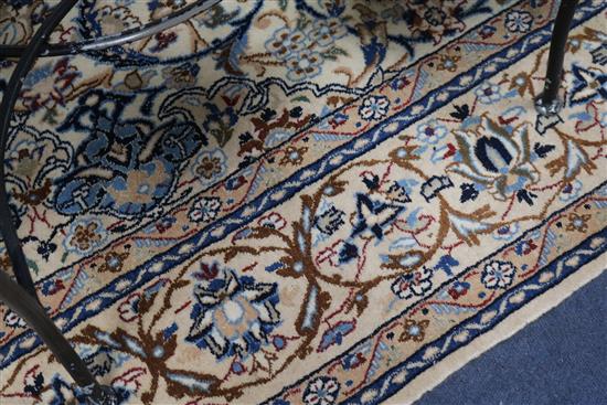A Persian cream ground rug 270 x 165cm